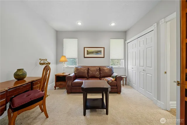 a view of a livingroom with furniture and staircase