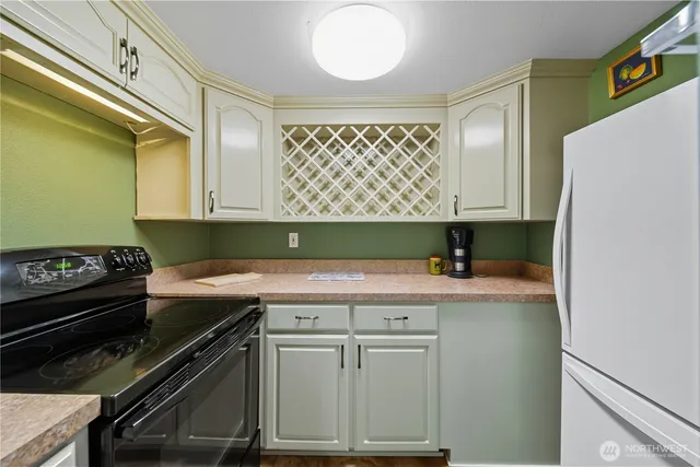 a living room with furniture and kitchen view