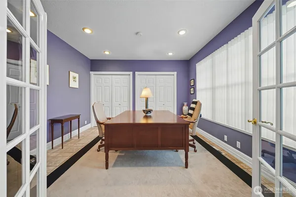 a room with furniture a rug and a window