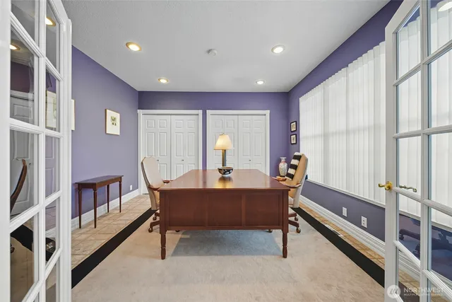 a room with furniture a rug and a window