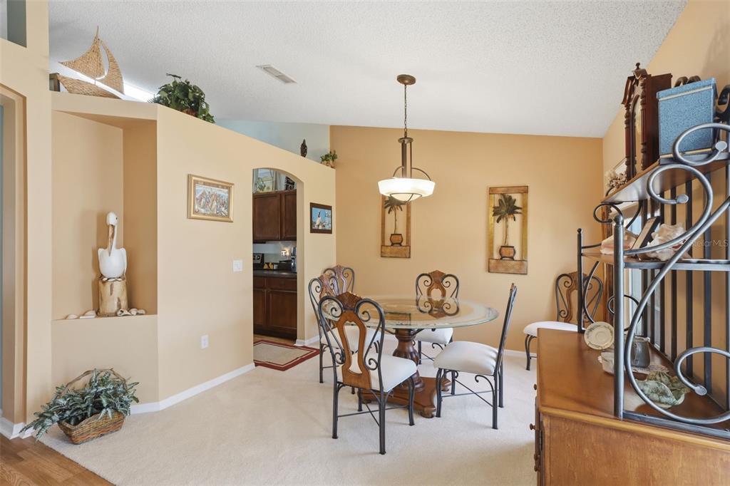 403 Central Mariners Drive Edgewater, FL 32141 - Photo 12 of 42 a view of a dining room with furniture and chandelier