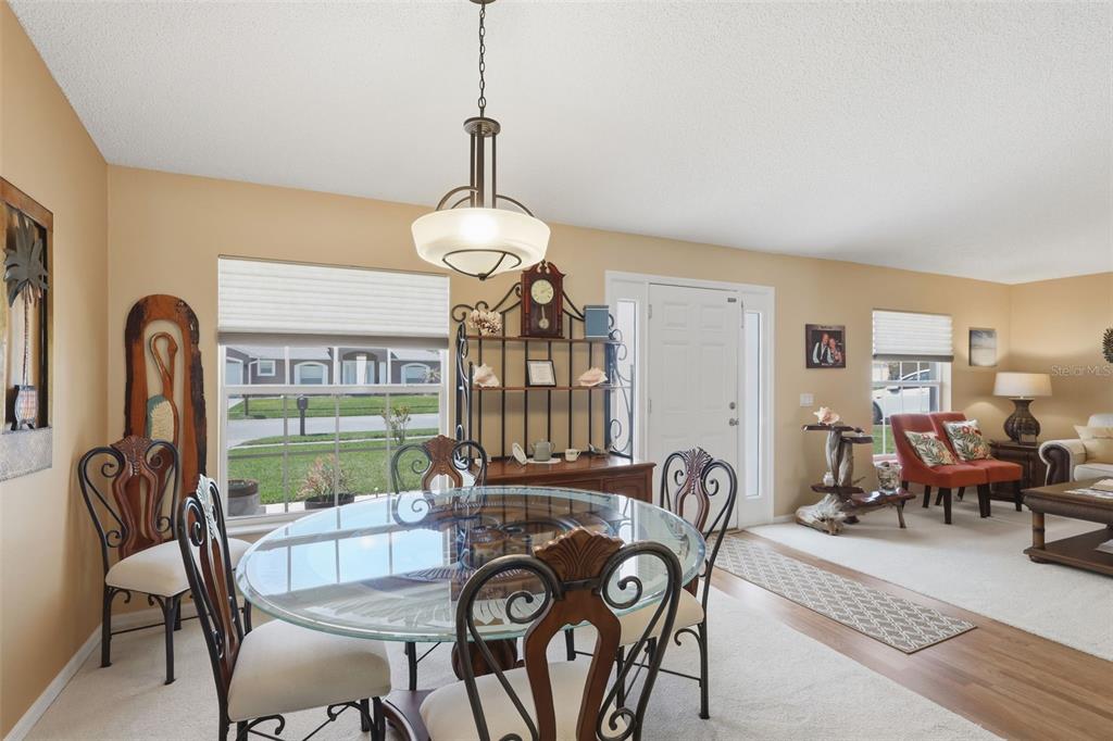 403 Central Mariners Drive Edgewater, FL 32141 - Photo 13 of 42 a view of a dining room with furniture window and wooden floor