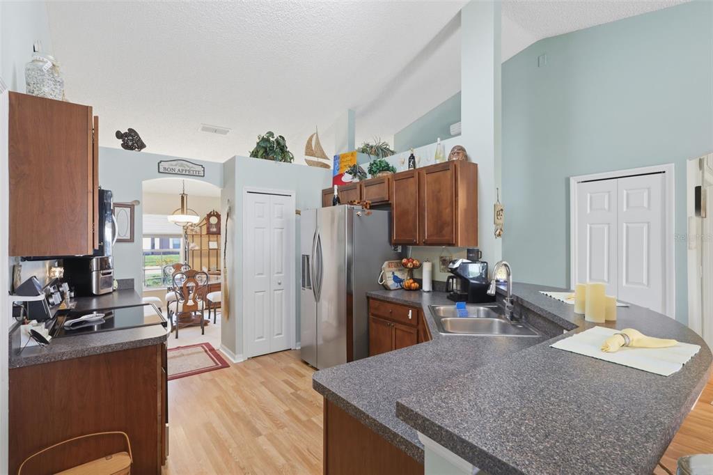 403 Central Mariners Drive Edgewater, FL 32141 - Photo 18 of 42 a kitchen with refrigerator and couch