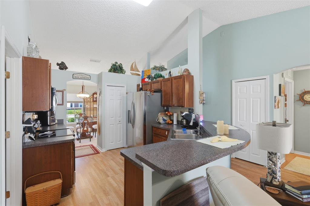 403 Central Mariners Drive Edgewater, FL 32141 - Photo 19 of 42 a view of a dining room with furniture a chandelier and wooden floor