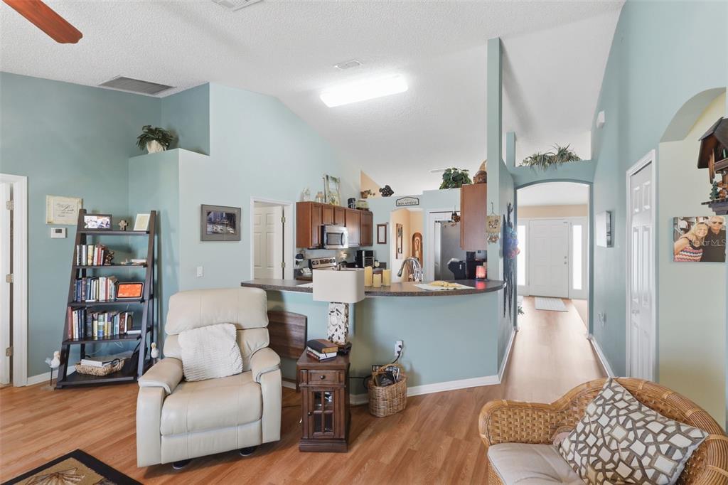 403 Central Mariners Drive Edgewater, FL 32141 - Photo 20 of 42 a living room with furniture and a book shelf