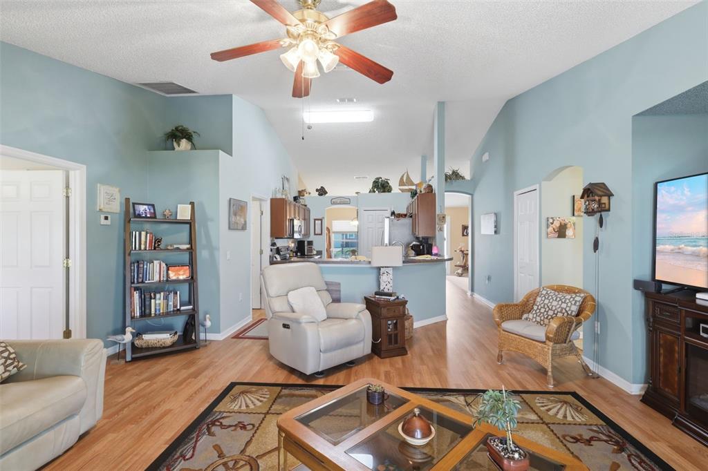 403 Central Mariners Drive Edgewater, FL 32141 - Photo 21 of 42 a living room with furniture and wooden floor
