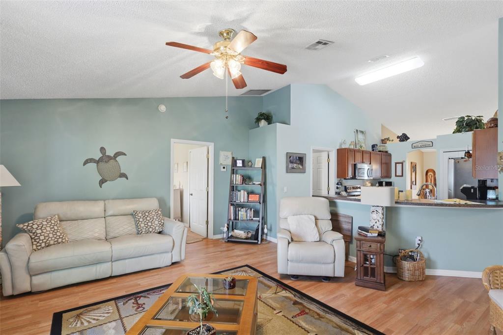 403 Central Mariners Drive Edgewater, FL 32141 - Photo 22 of 42 a living room with furniture and a chandelier