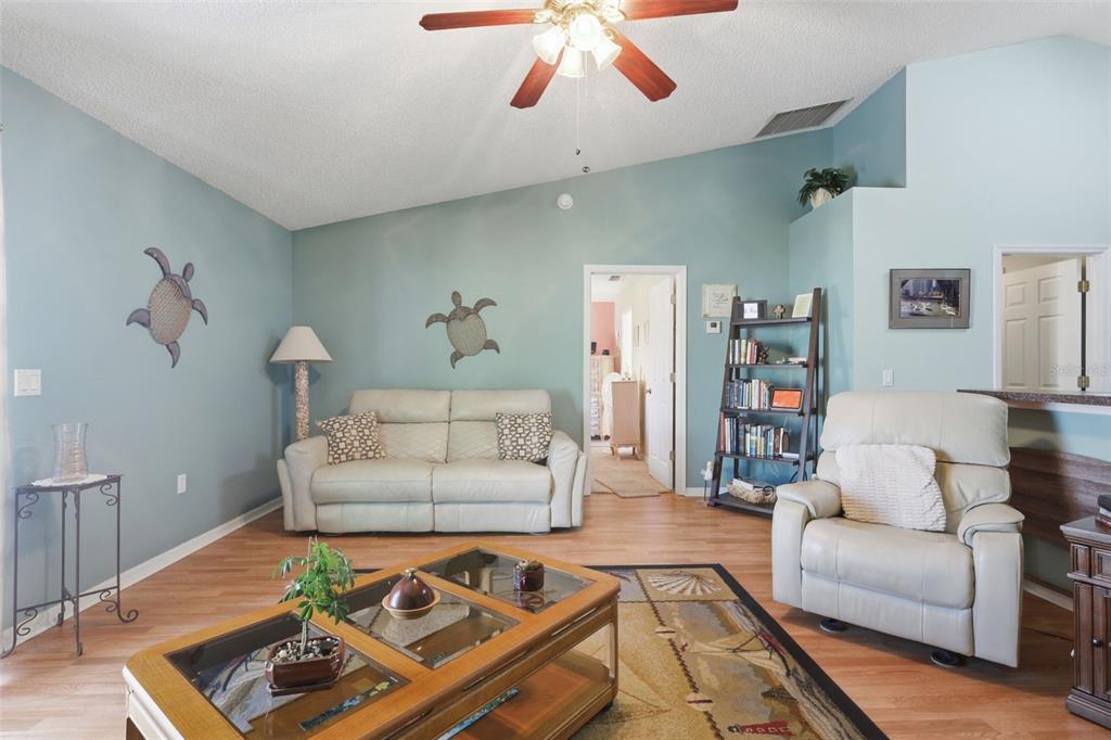 403 Central Mariners Drive Edgewater, FL 32141 - Photo 23 of 42 a living room with furniture and a couch