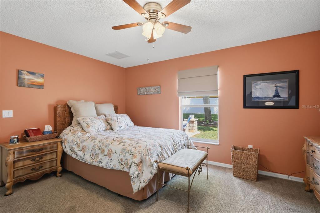 403 Central Mariners Drive Edgewater, FL 32141 - Photo 25 of 42 a bedroom with furniture and a window