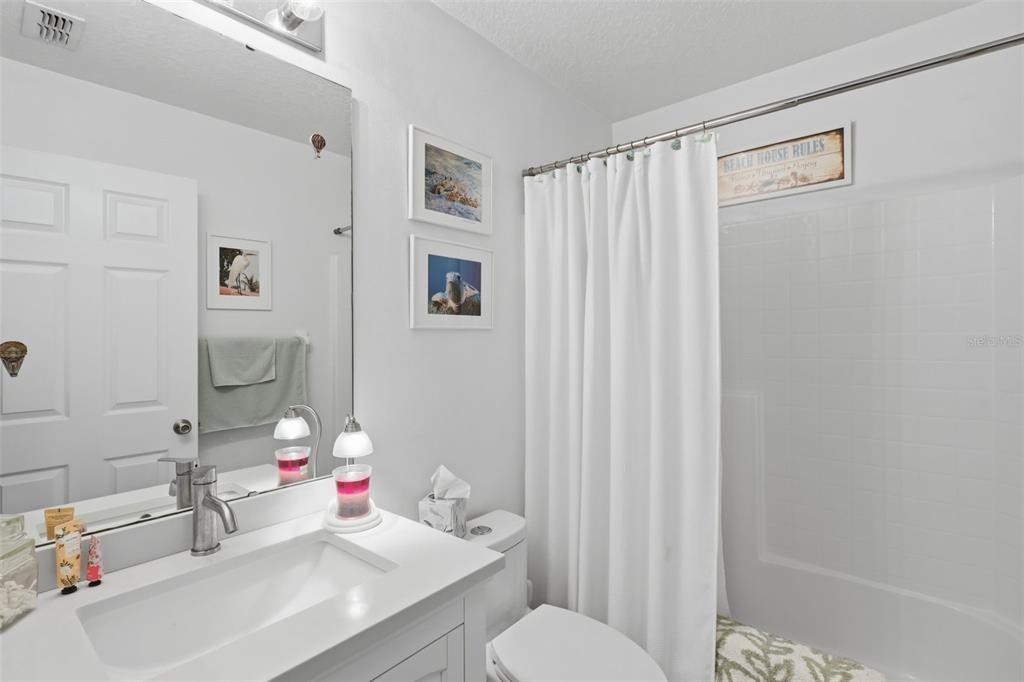 403 Central Mariners Drive Edgewater, FL 32141 - Photo 29 of 42 a bathroom with a sink vanity mirror and toilet