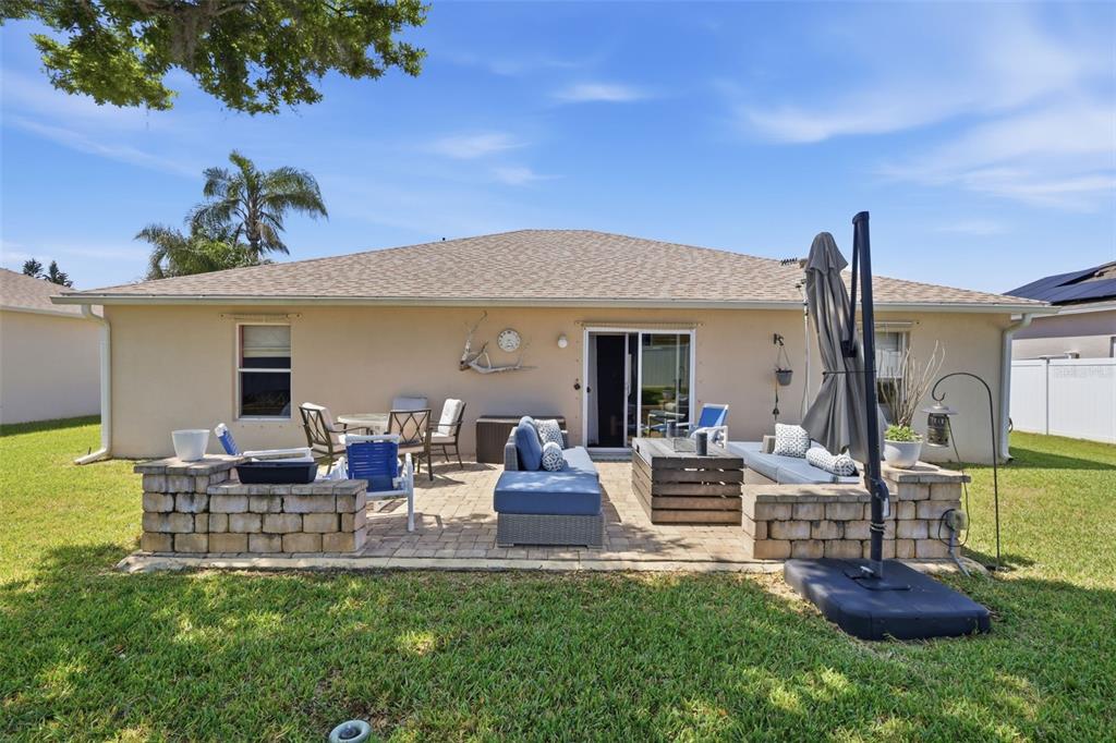 403 Central Mariners Drive Edgewater, FL 32141 - Photo 32 of 42 a front view of a house with garden