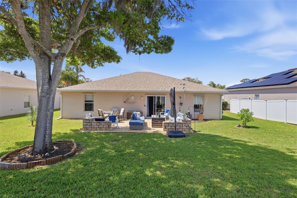 403 Central Mariners Drive Edgewater, FL 32141 - Photo 33 of 42 a front view of a house with garden and sitting area