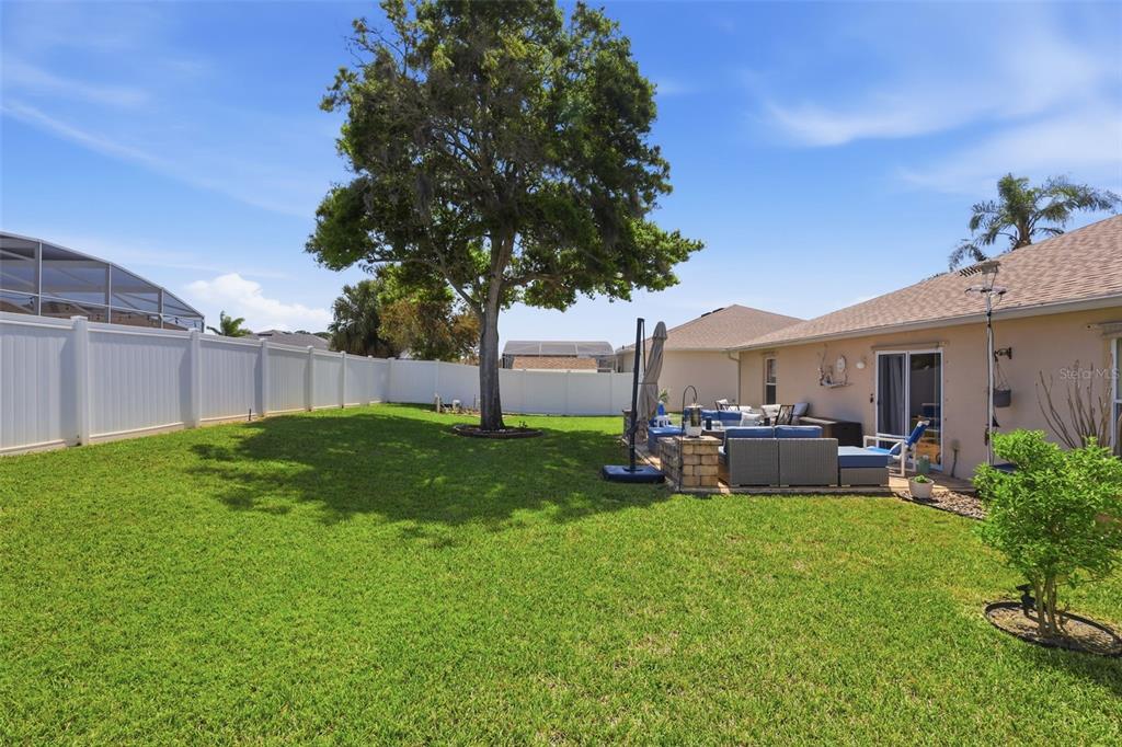 403 Central Mariners Drive Edgewater, FL 32141 - Photo 34 of 42 a view of a house with backyard and sitting area