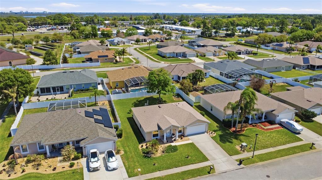 403 Central Mariners Drive Edgewater, FL 32141 - Photo 40 of 42 an aerial view of residential houses with outdoor space and parking