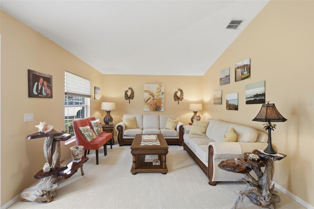 403 Central Mariners Drive Edgewater, FL 32141 - Photo 8 of 42 a living room with furniture and a wooden floor