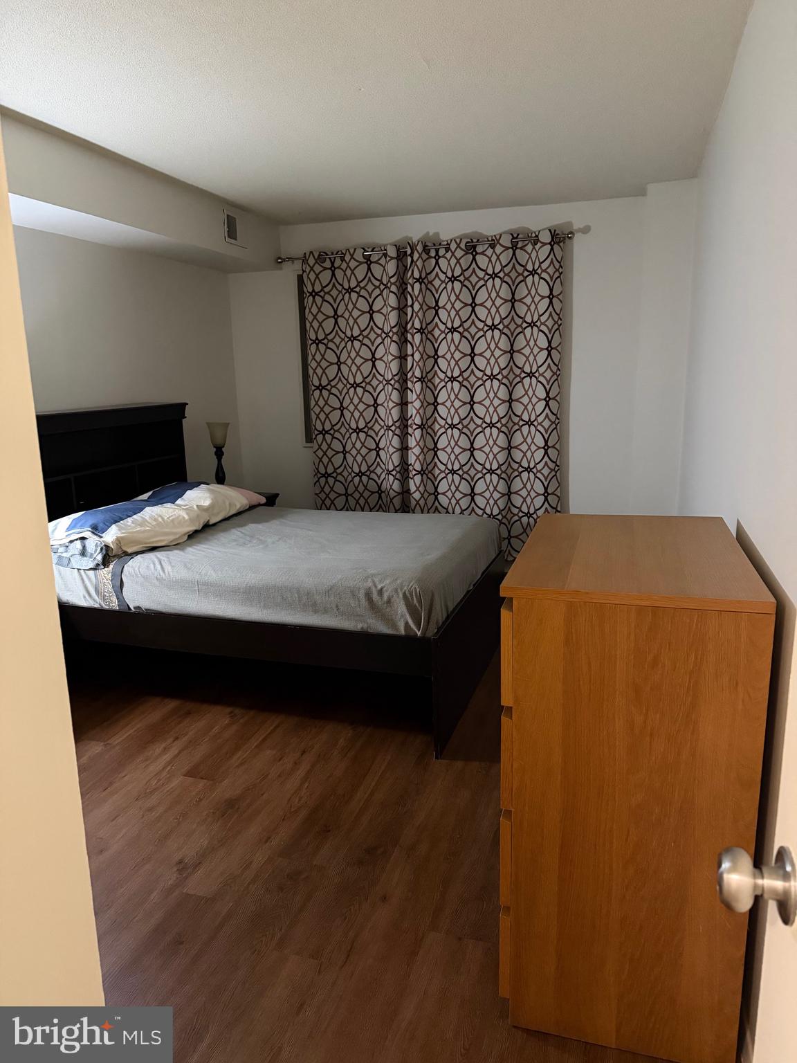 1836 Southwest Metzerott Road, Unit 1524 Hyattsville, MD 20783 - Photo 12 of 18 a bedroom with a bed and a window