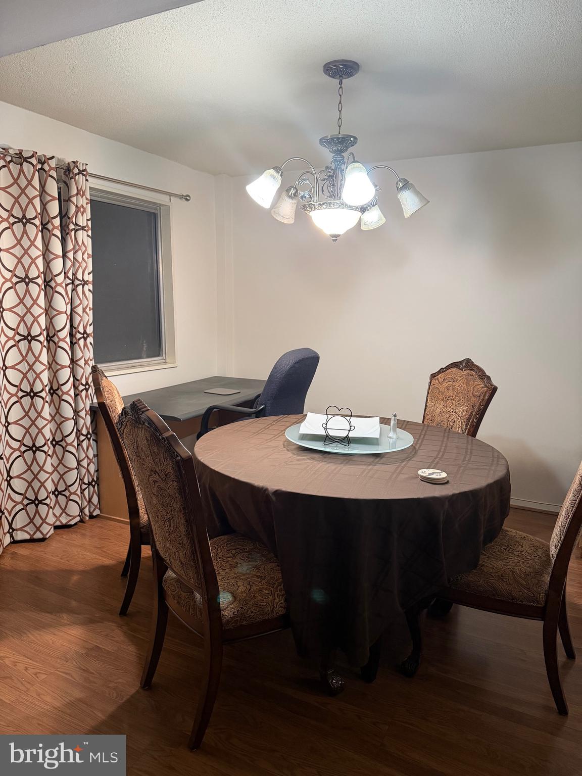 1836 Southwest Metzerott Road, Unit 1524 Hyattsville, MD 20783 - Photo 14 of 18 a view of a dining room with furniture and wooden floor