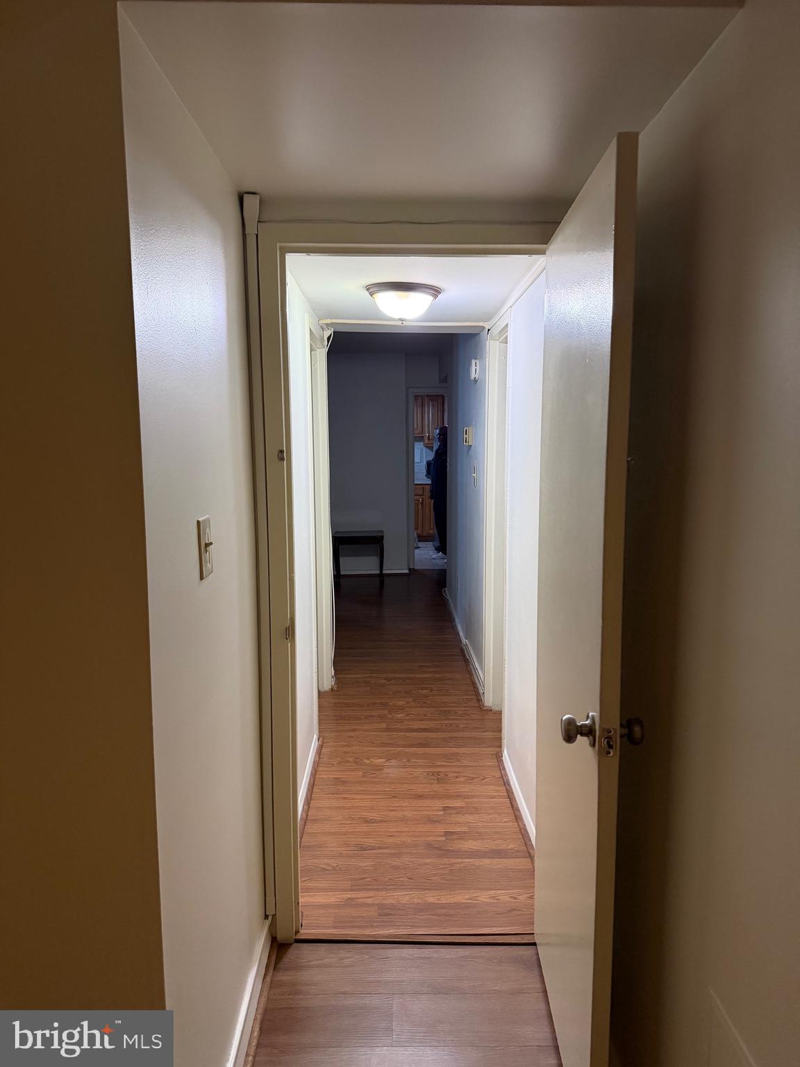 1836 Southwest Metzerott Road, Unit 1524 Hyattsville, MD 20783 - Photo 16 of 18 a view of a hallway with wooden shelves