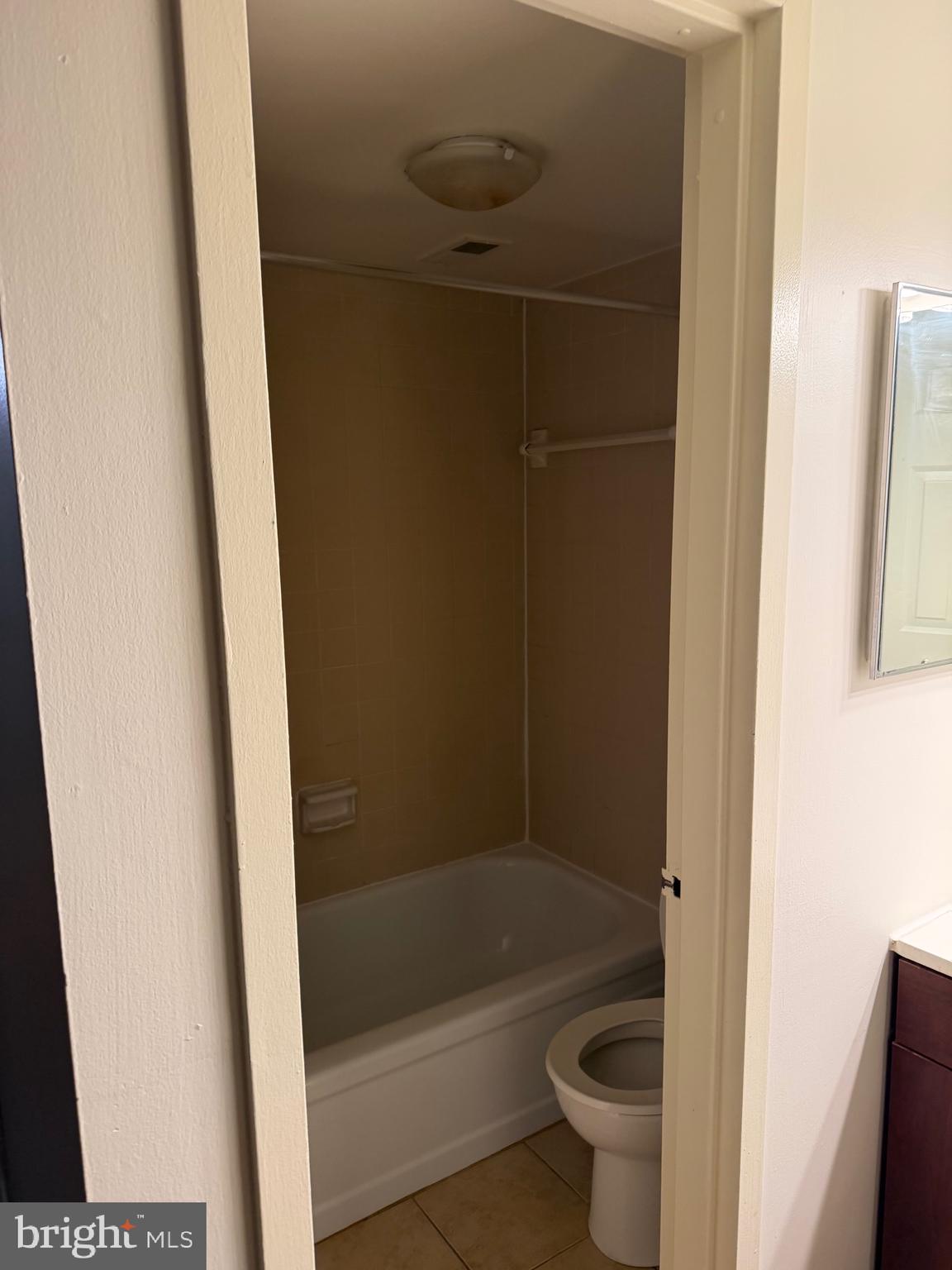 1836 Southwest Metzerott Road, Unit 1524 Hyattsville, MD 20783 - Photo 17 of 18 a bathroom with a bathtub and a toilet