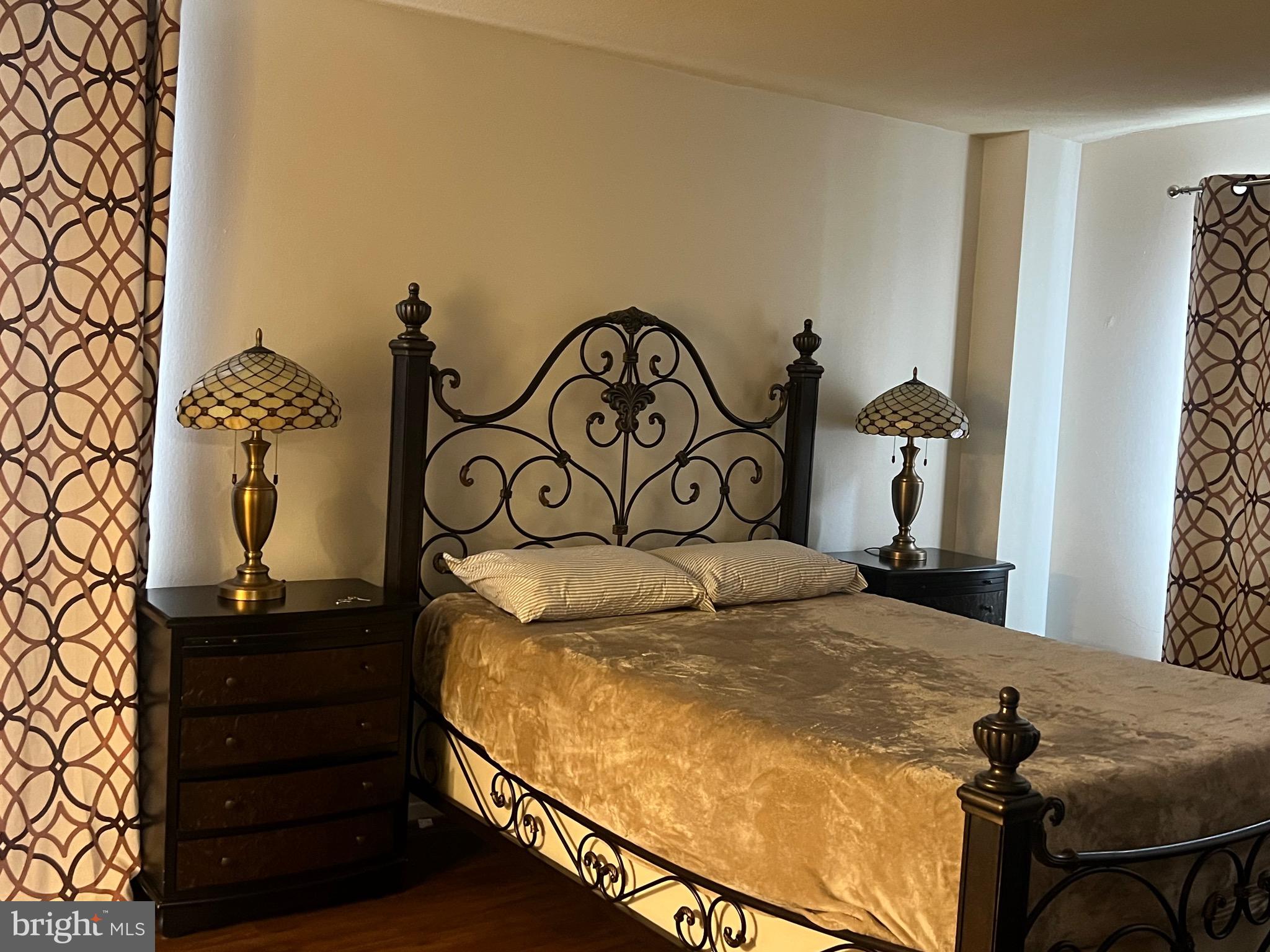 1836 Southwest Metzerott Road, Unit 1524 Hyattsville, MD 20783 - Photo 4 of 18 a bedroom with a bed and a dresser