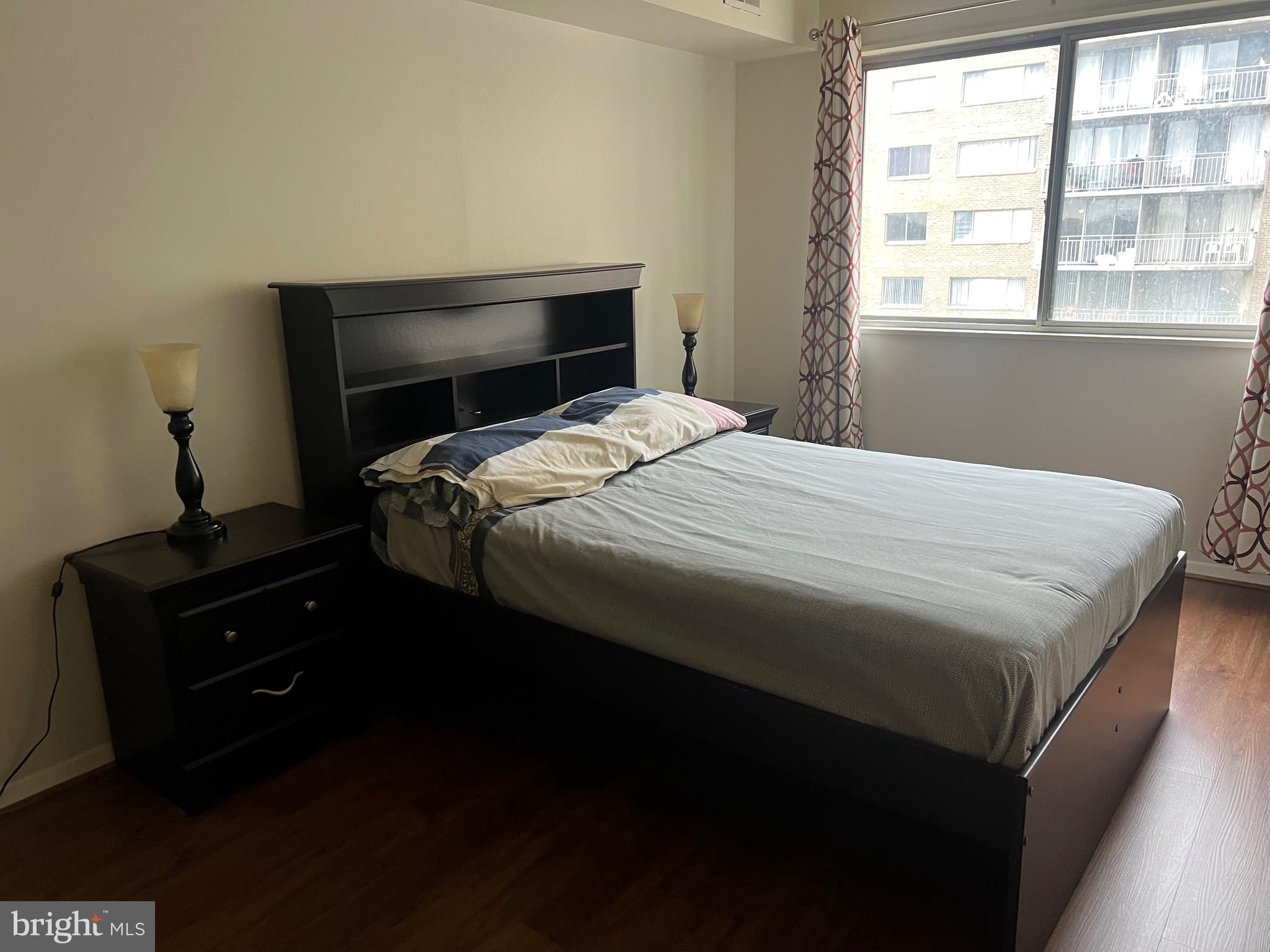 1836 Southwest Metzerott Road, Unit 1524 Hyattsville, MD 20783 - Photo 6 of 18 a bedroom with a bed and a window