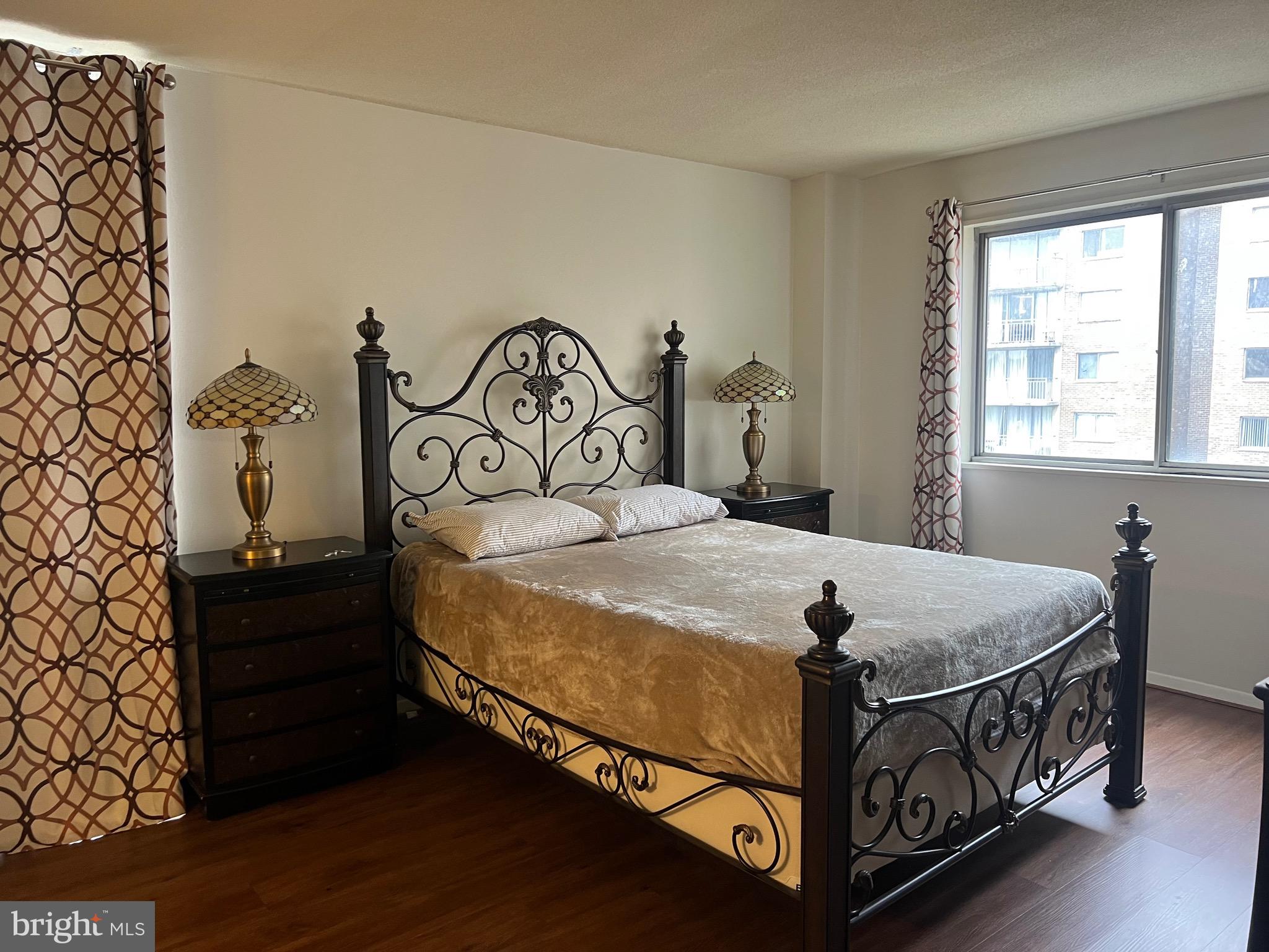 1836 Southwest Metzerott Road, Unit 1524 Hyattsville, MD 20783 - Photo 7 of 18 a bedroom with a bed and a window