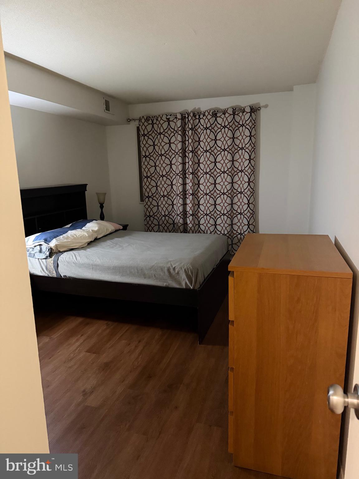 1836 Southwest Metzerott Road, Unit 1524 Hyattsville, MD 20783 - Photo 10 of 18 a bedroom with a bed and a window