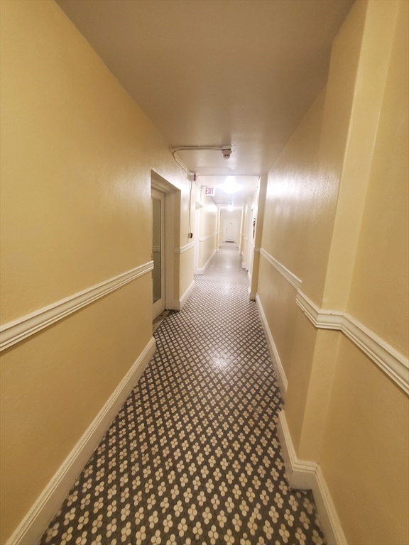 415 County Street, Unit 116 New Bedford, MA 02740 - Photo 14 of 14 a view of a hallway