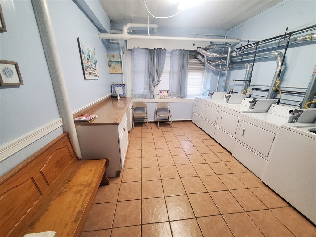 415 County Street, Unit 116 New Bedford, MA 02740 - Photo 10 of 14 a utility room with dryer and washer