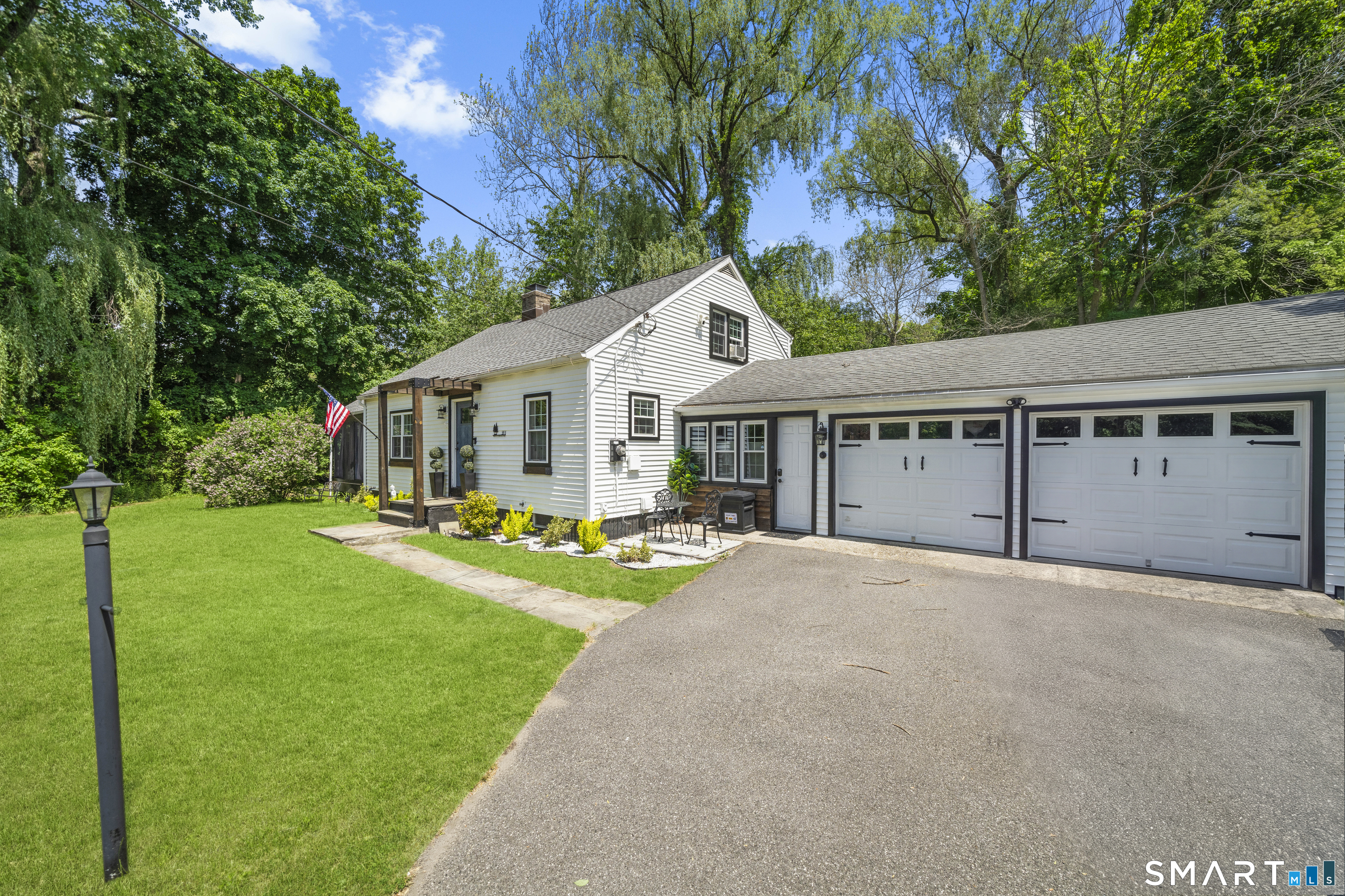 211 Whisconier Road Brookfield, CT 06804 - Photo 3 of 38 a front view of a house with yard porch and green space