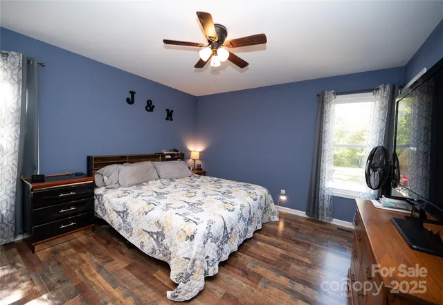 a bedroom with bed and window