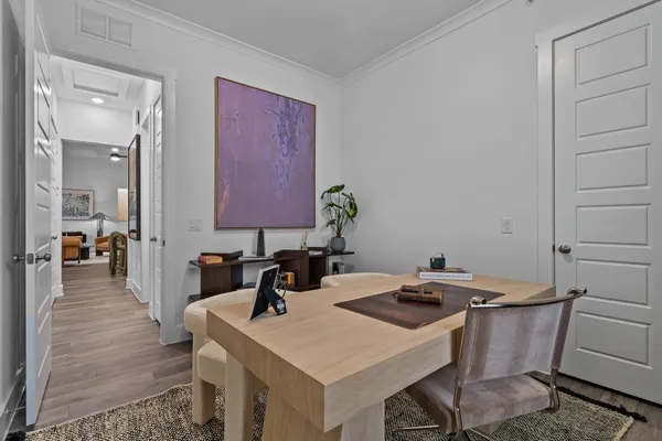 a kitchen that has a table and chairs in it