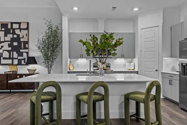 a kitchen with a table and chairs
