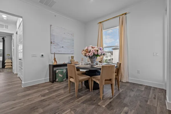 a dining room with furniture and window