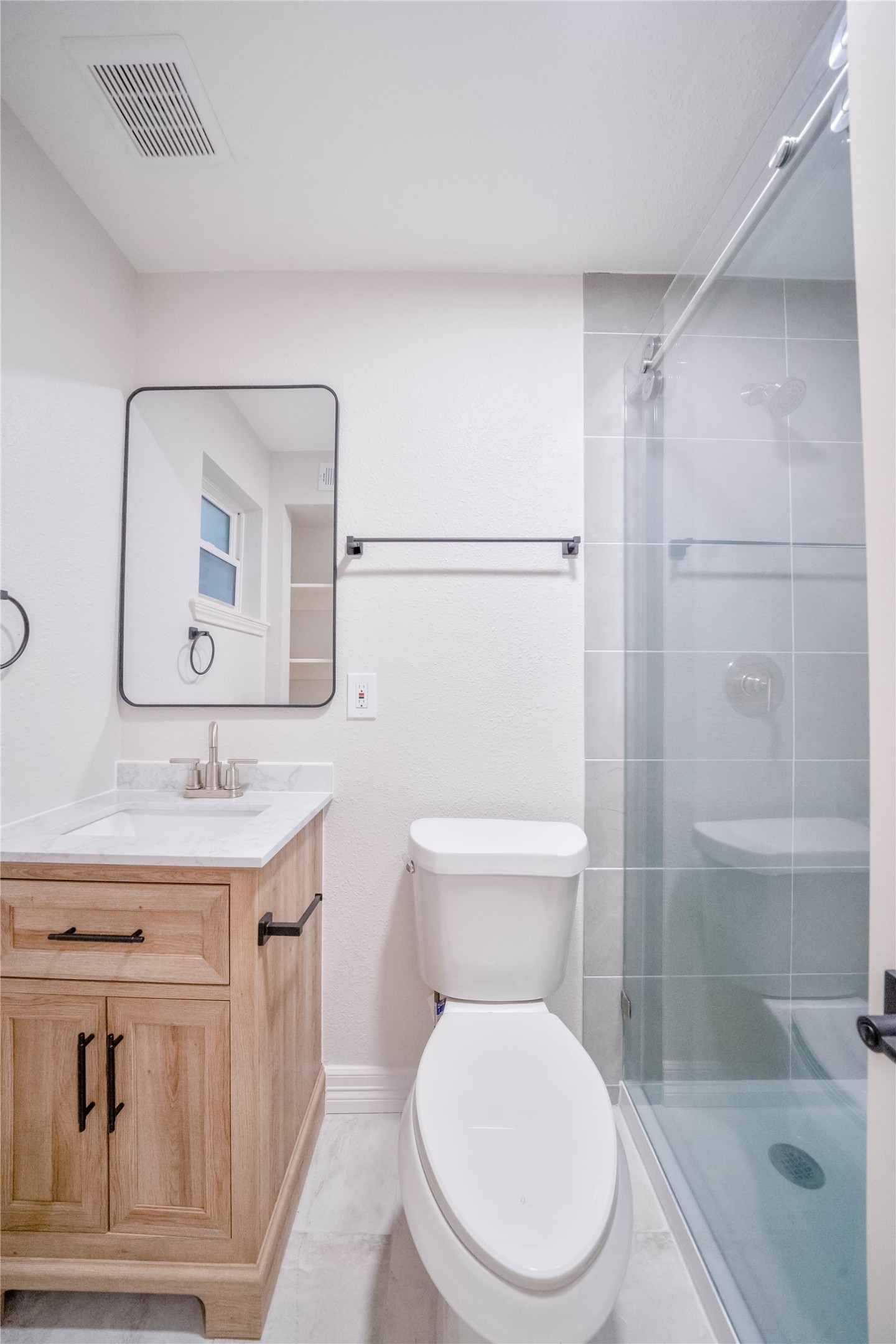 2703 Mason Street, Unit 2BD Houston, TX 77006 - Photo 14 of 19 a bathroom with a toilet a sink and shower