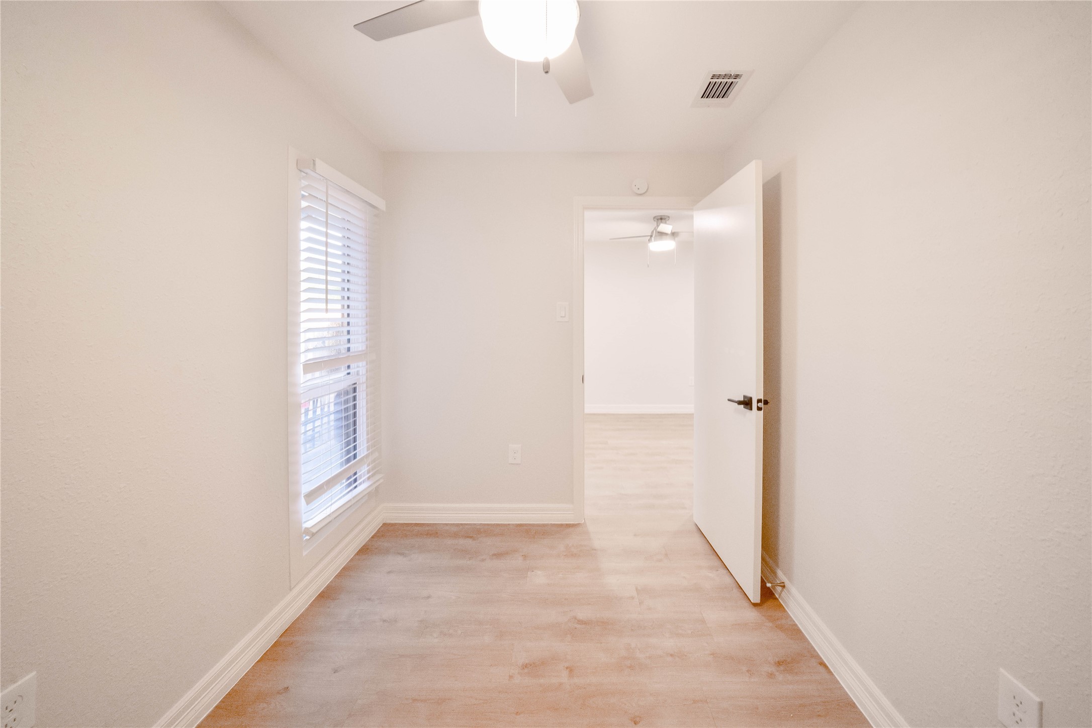 2703 Mason Street, Unit 2BD Houston, TX 77006 - Photo 5 of 19 a view of a room with an empty space and a window