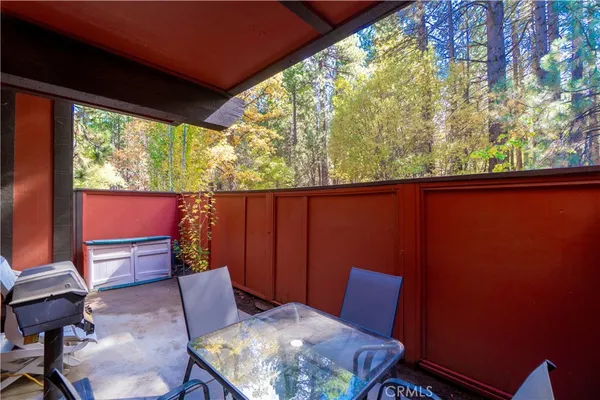 a wooden bench sitting in a backyard