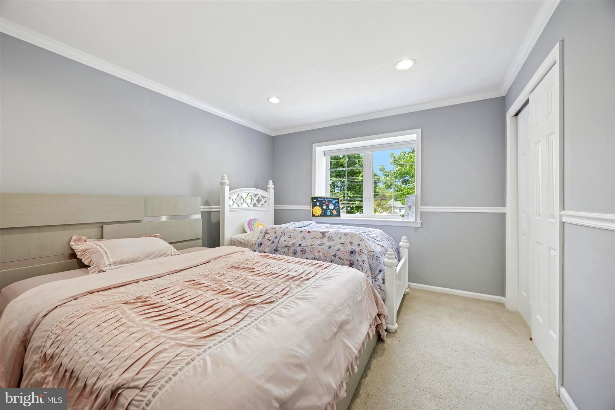 164 West Thompson Avenue Springfield, PA 19064 - Photo 17 of 28 a bedroom with a bed and a window