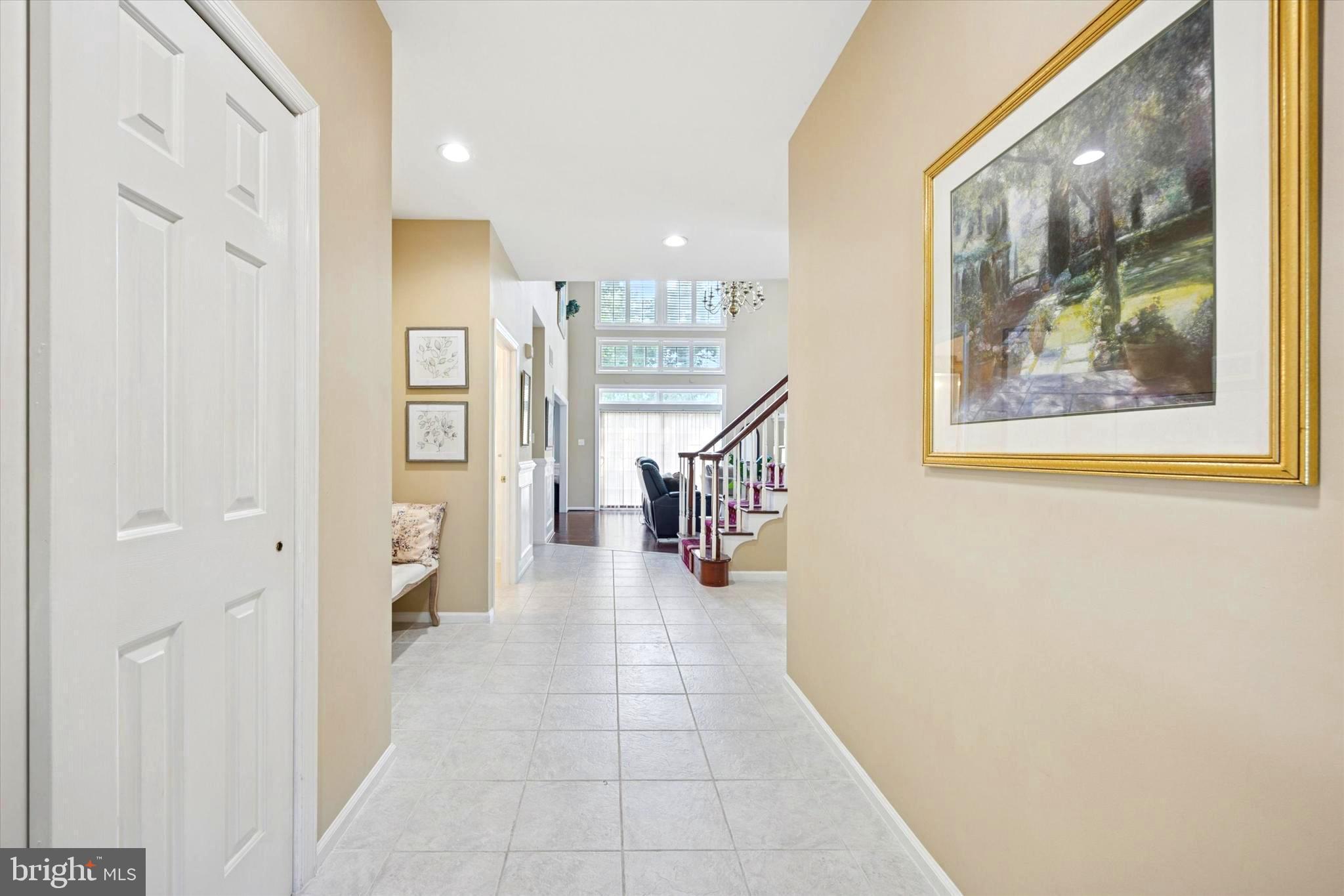 164 West Thompson Avenue Springfield, PA 19064 - Photo 2 of 28 a view of a hallway with wooden floor and furniture