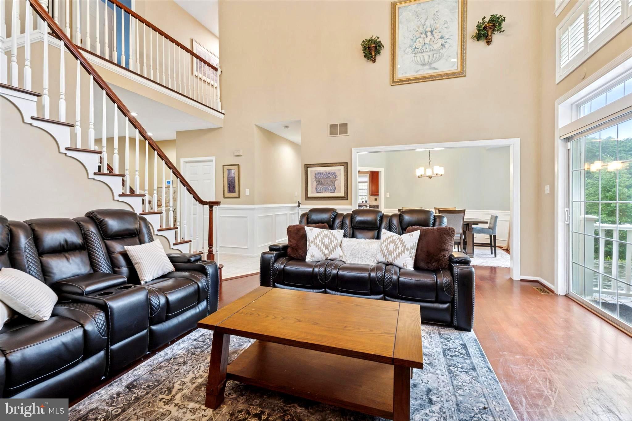 164 West Thompson Avenue Springfield, PA 19064 - Photo 4 of 28 a living room with furniture wooden floor and a large window