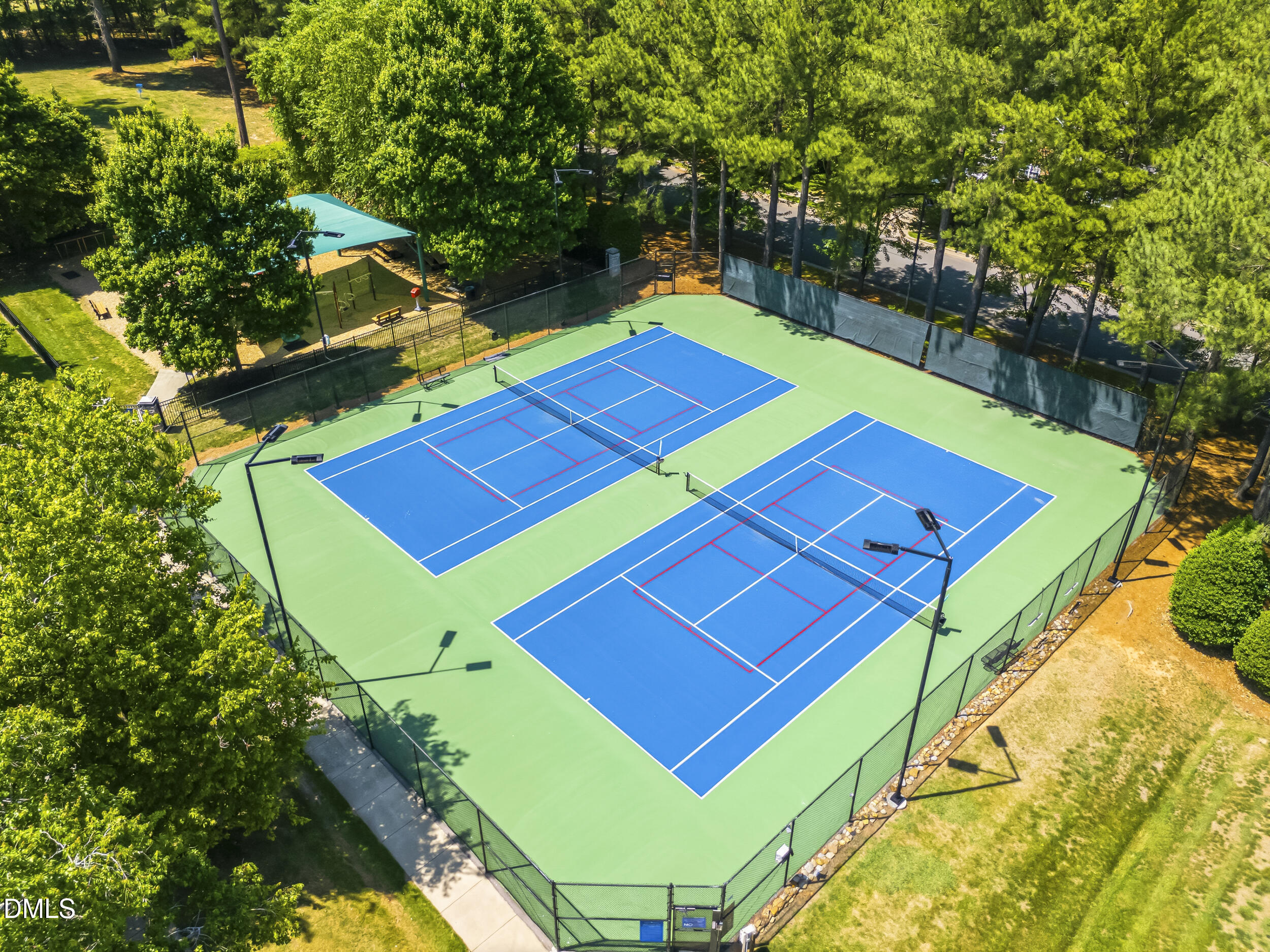 112 Ryder Cup Circle Raleigh, NC 27603 - Photo 39 of 45 a view of a tennis ground with large trees