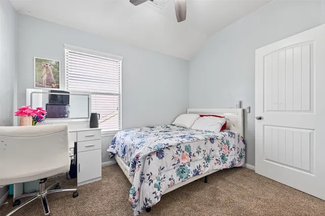 a bedroom with a bed and a table