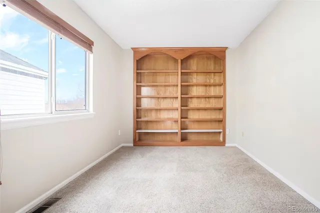 an empty room with a empty space and window