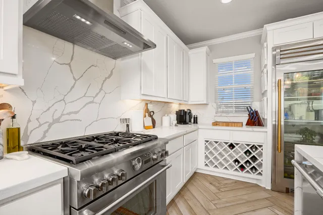 a kitchen with a stove and a cabinets