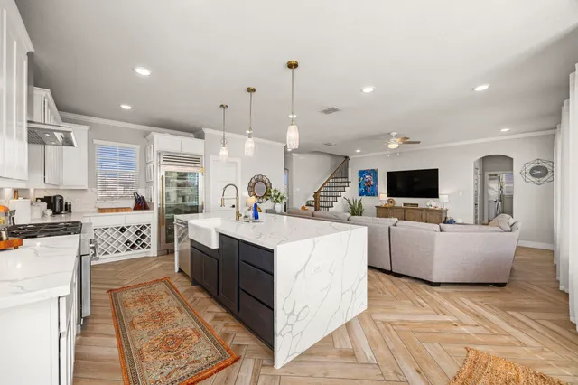 a large white kitchen with lots of counter space
