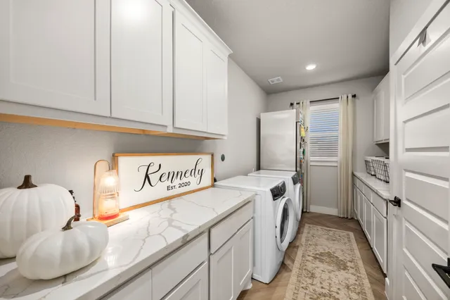 a bedroom with a bed dresser and a flat screen tv