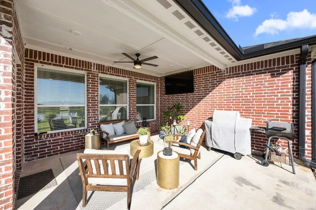 a view of a patio with a yard