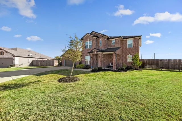 a house view with a garden space