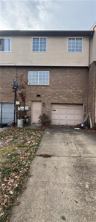 7305 Bennett Street Pittsburgh, PA 15208 - Photo 2 of 12 a front view of a house with a yard