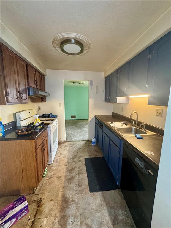 7305 Bennett Street Pittsburgh, PA 15208 - Photo 5 of 12 a kitchen with stainless steel appliances granite countertop a stove a sink and a refrigerator